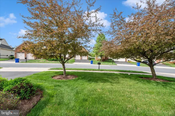 a view of an outdoor space and tennis court