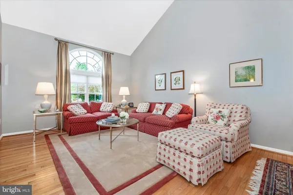 a living room with furniture and a rug