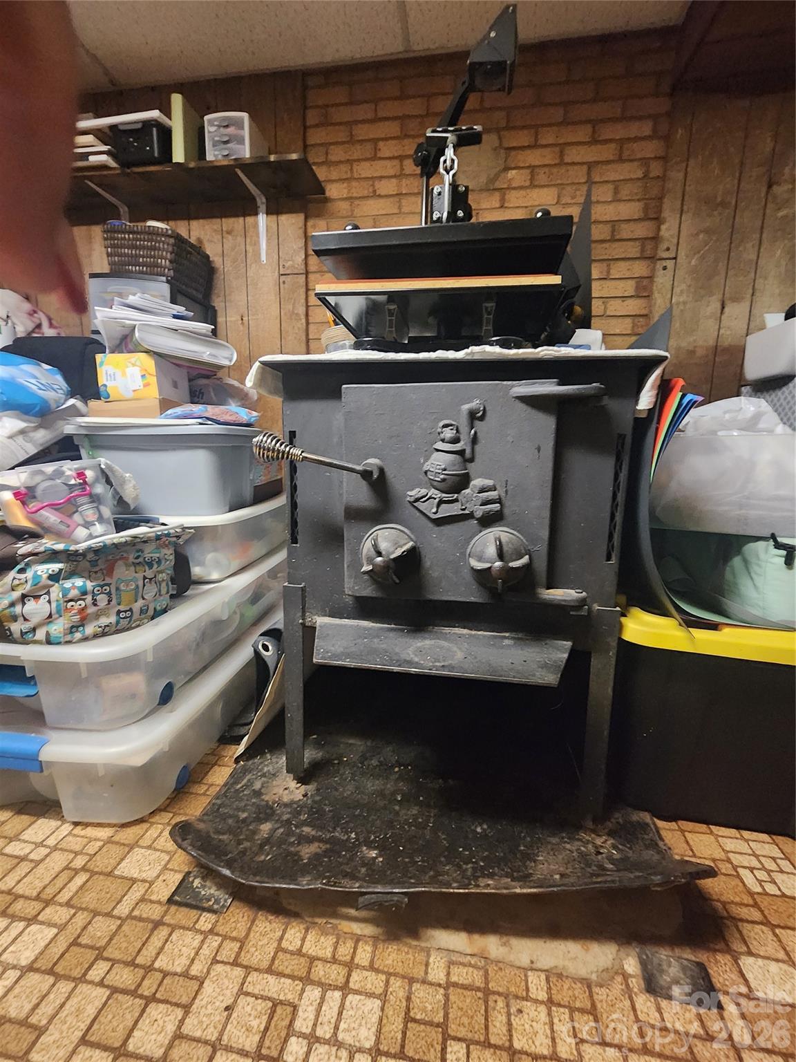 7723 Shoupes Grove Church Road Hickory, NC 28602 - Photo 11 of 24 a room with a stove and a table