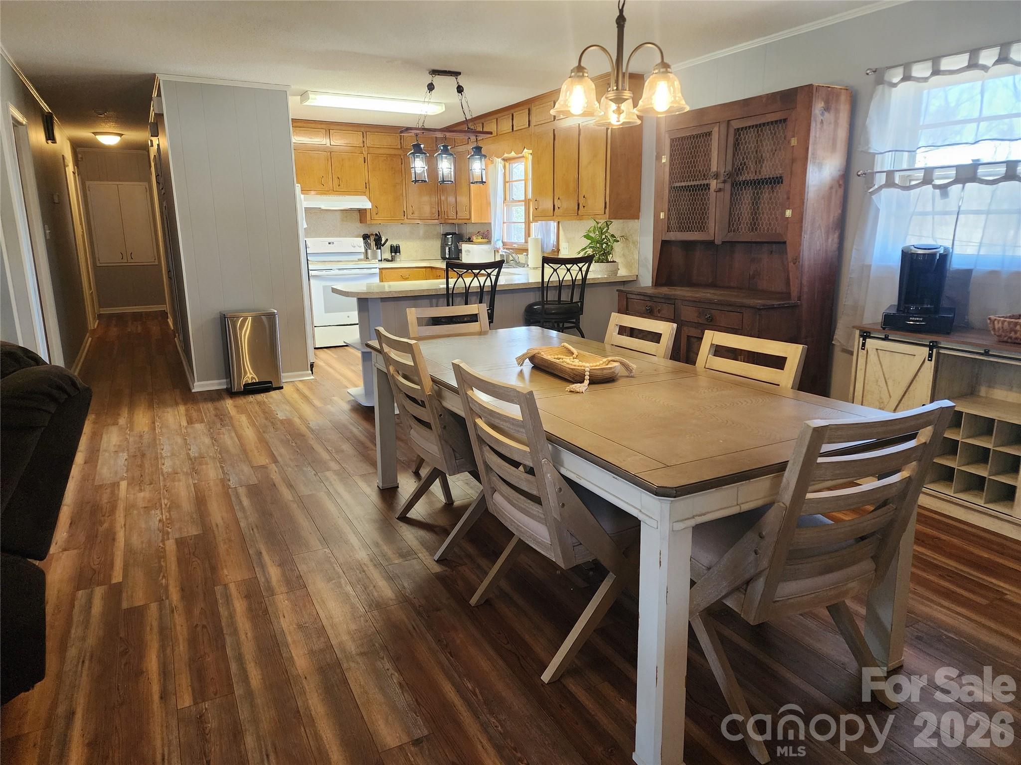 7723 Shoupes Grove Church Road Hickory, NC 28602 - Photo 2 of 24 a view of a dining room with furniture window and wooden floor