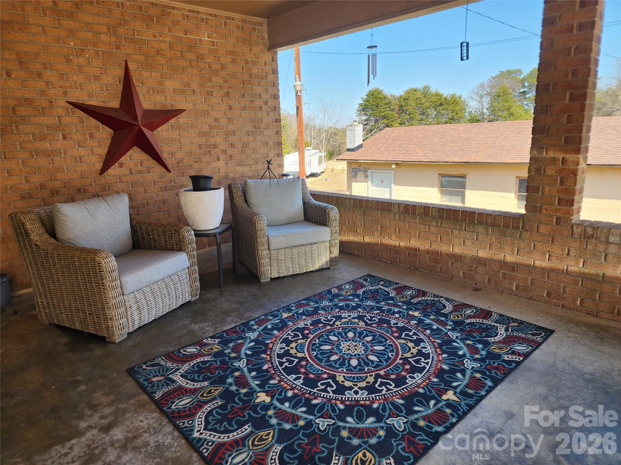 7723 Shoupes Grove Church Road Hickory, NC 28602 - Photo 24 of 24 a living room with a couch and a potted plant
