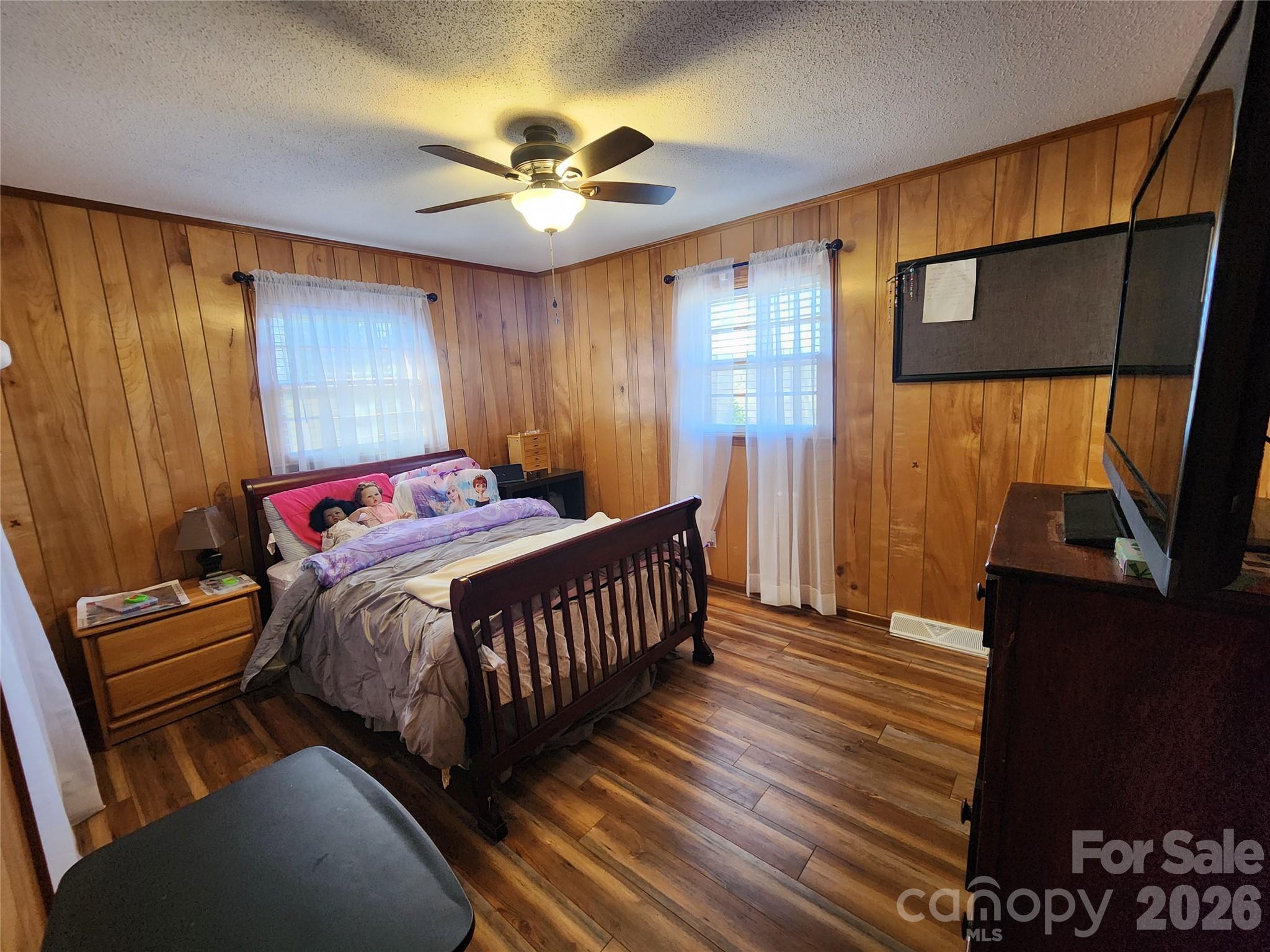 7723 Shoupes Grove Church Road Hickory, NC 28602 - Photo 9 of 24 a bedroom with a bed and wooden floor