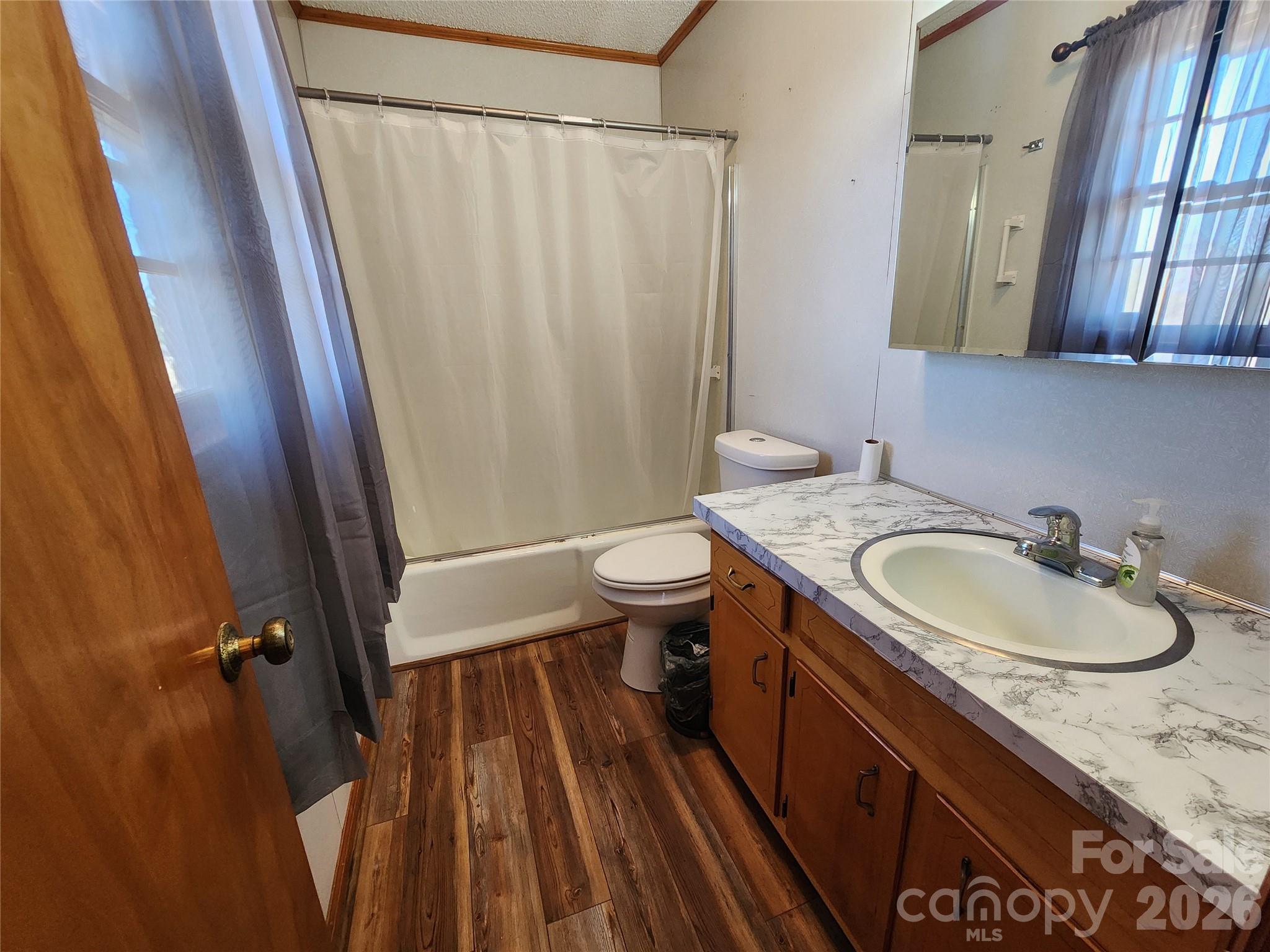 7723 Shoupes Grove Church Road Hickory, NC 28602 - Photo 10 of 24 a bathroom with a granite countertop sink toilet and shower