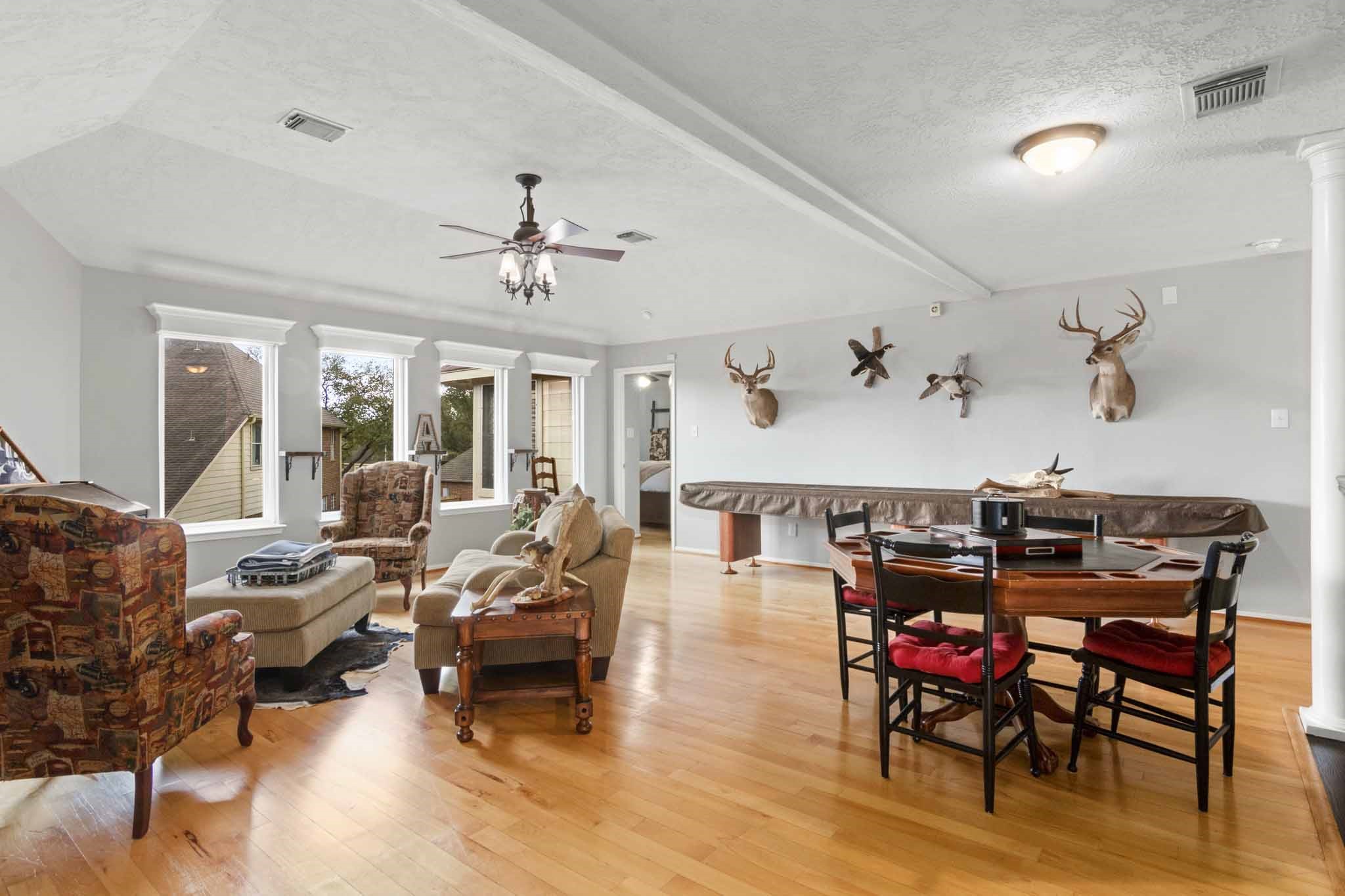 4311 Green Tree Court Pasadena, TX 77505 - Photo 28 of 49 Upstairs Game Room, with shuffle board.