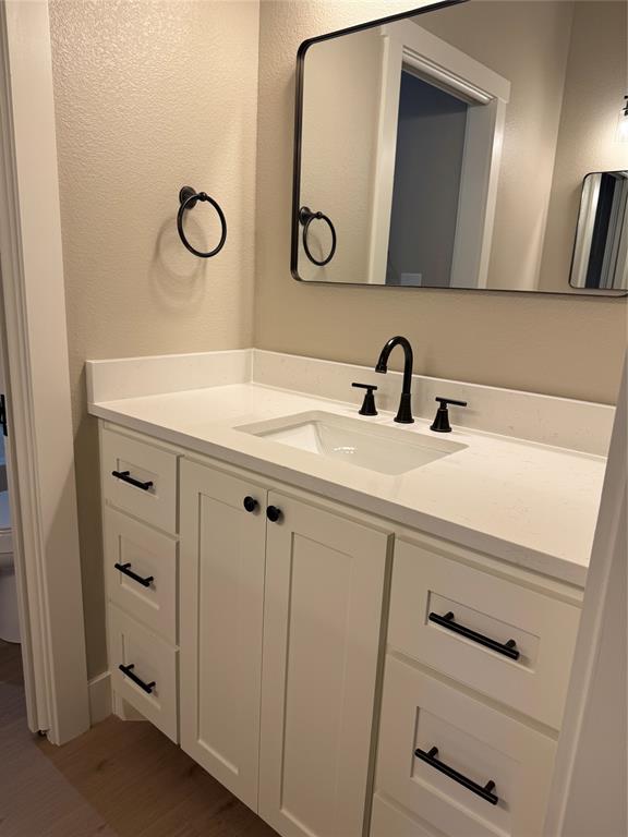 143 Ridge Road Tuscola, TX 79562 - Photo 21 of 24 a bathroom with a sink and a mirror