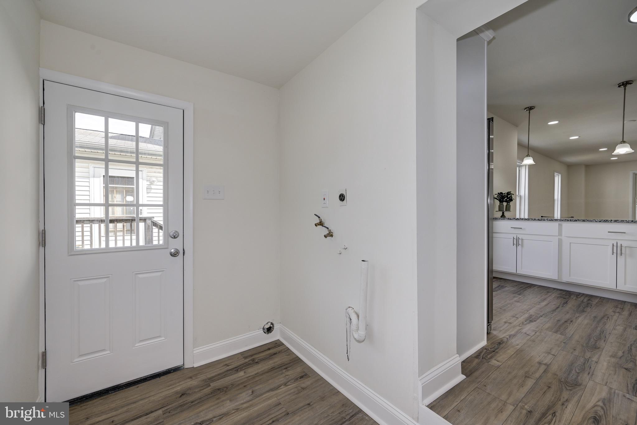 304 Cleveland Avenue Riverside, NJ 08075 - Photo 20 of 35 an empty room with wooden floor and windows