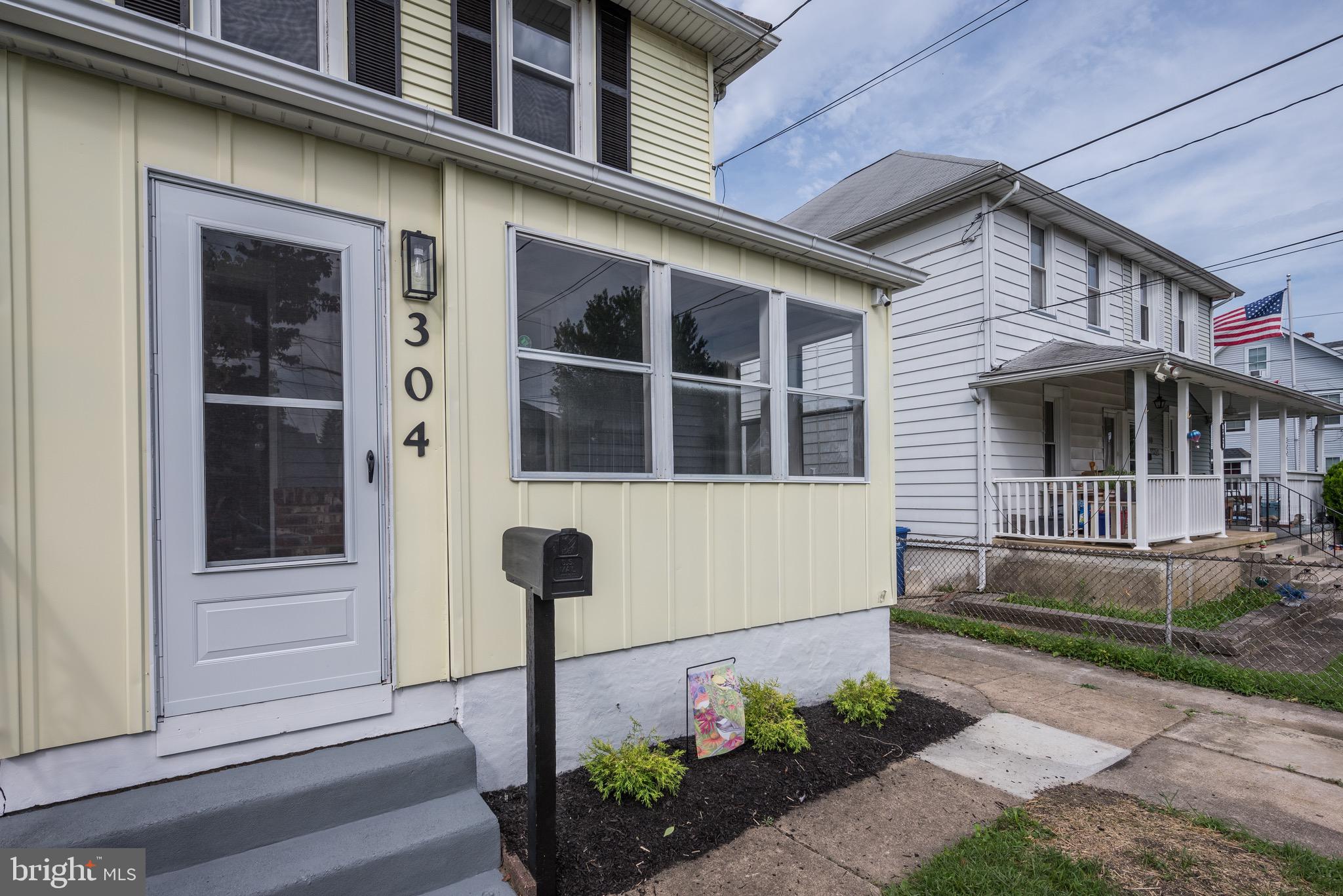 304 Cleveland Avenue Riverside, NJ 08075 - Photo 3 of 35 a front view of a house with a garden