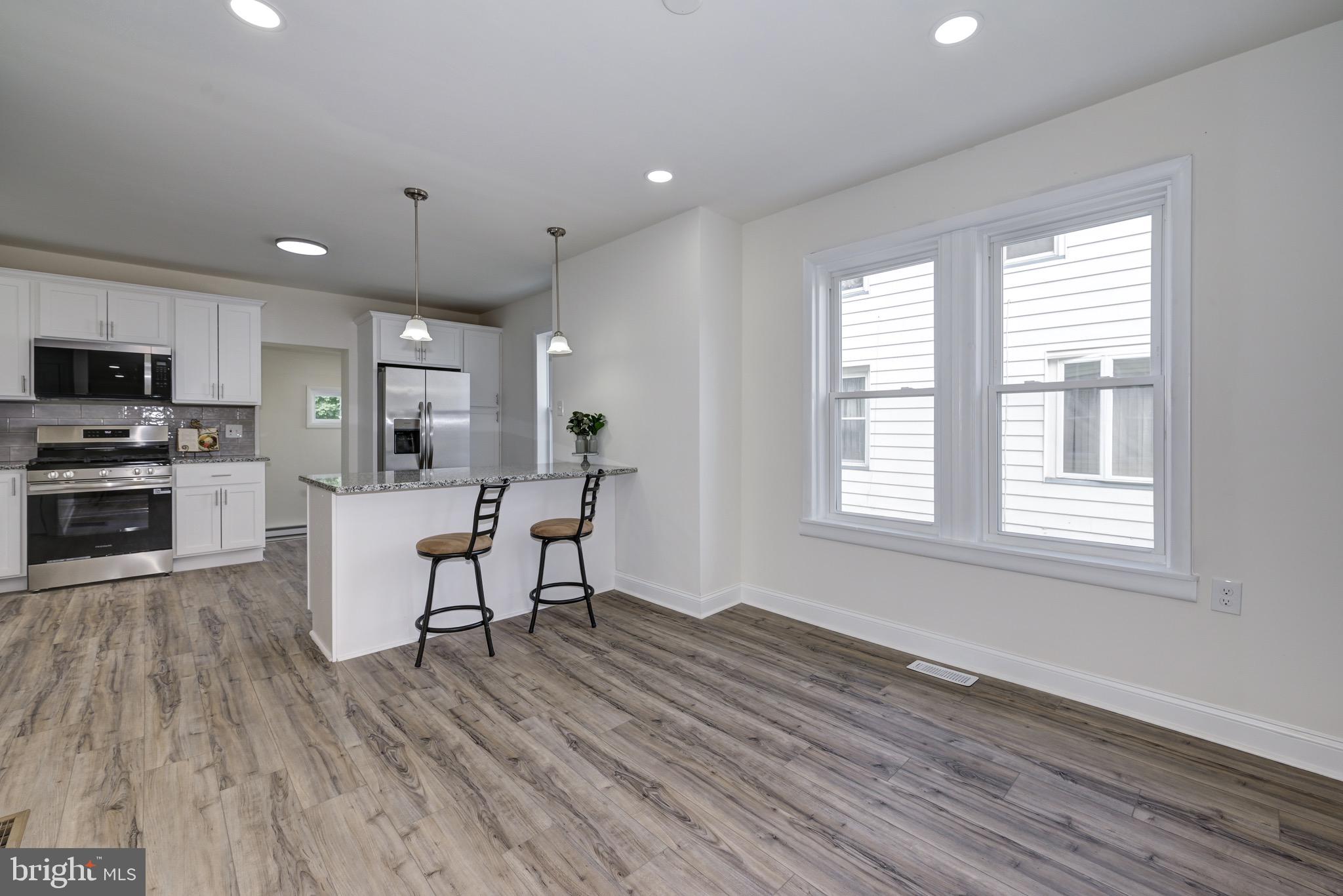 304 Cleveland Avenue Riverside, NJ 08075 - Photo 10 of 35 a view of a kitchen with furniture and wooden floor