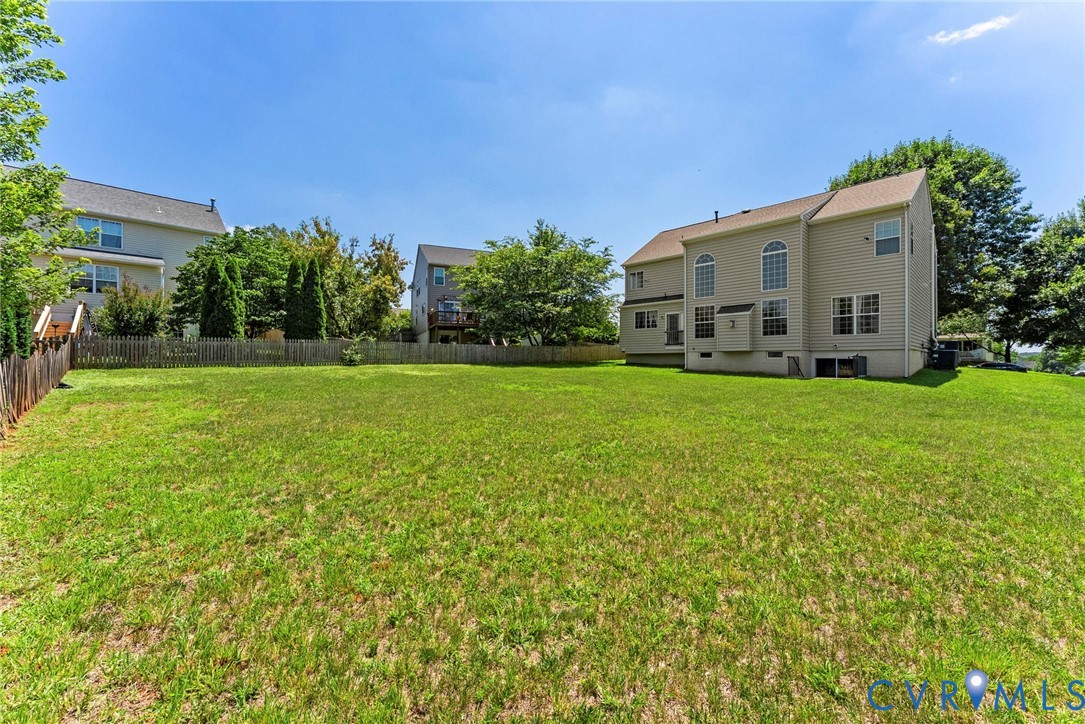 753 Blossom Tree Road Culpeper, VA 22701 - Photo 68 of 68 Expansive green lawn with a partial wood privacy f