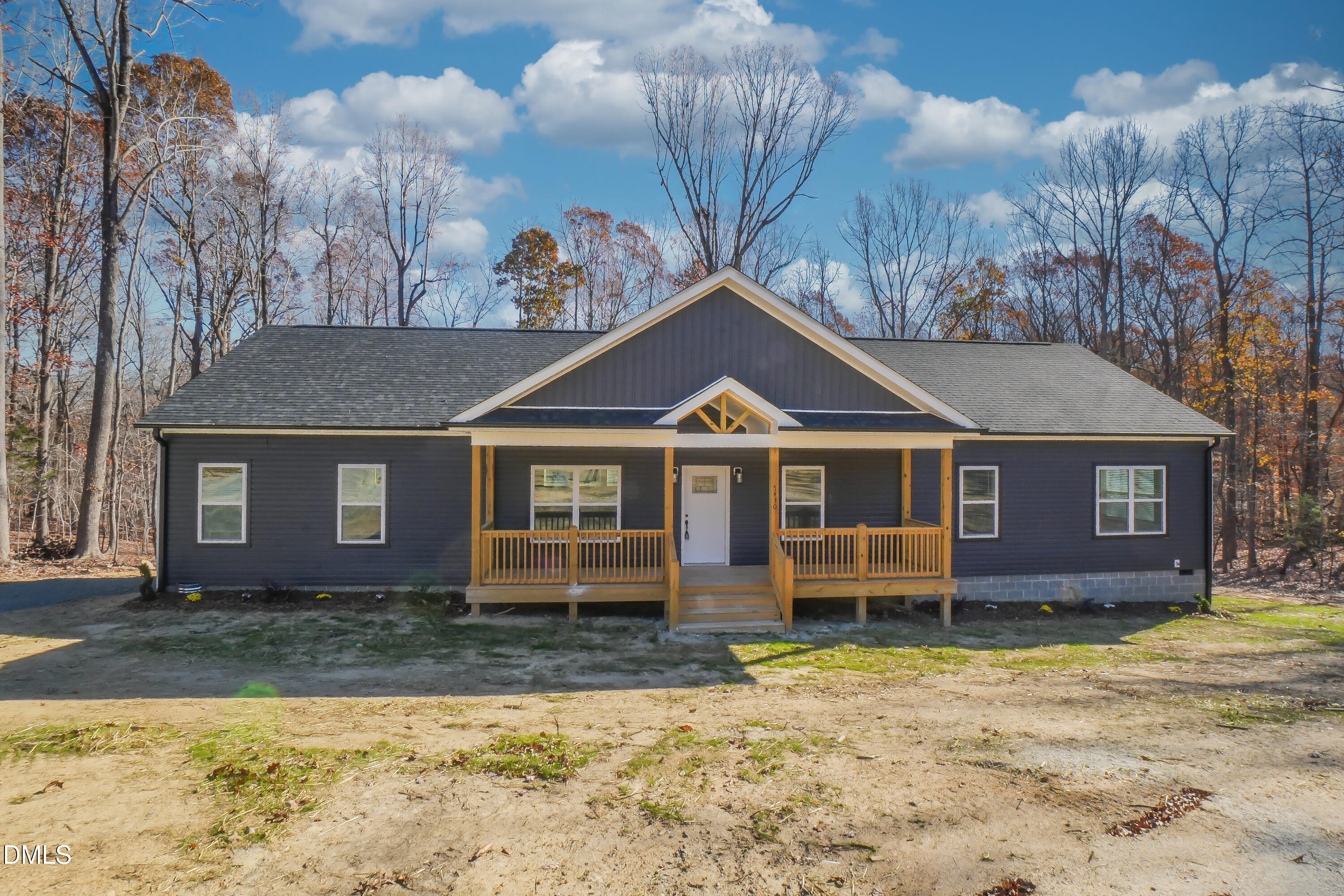 5430 Bass Mountain Road Snow Camp, NC 27349 - Photo 1 of 14 a front view of a house with a yard and garage