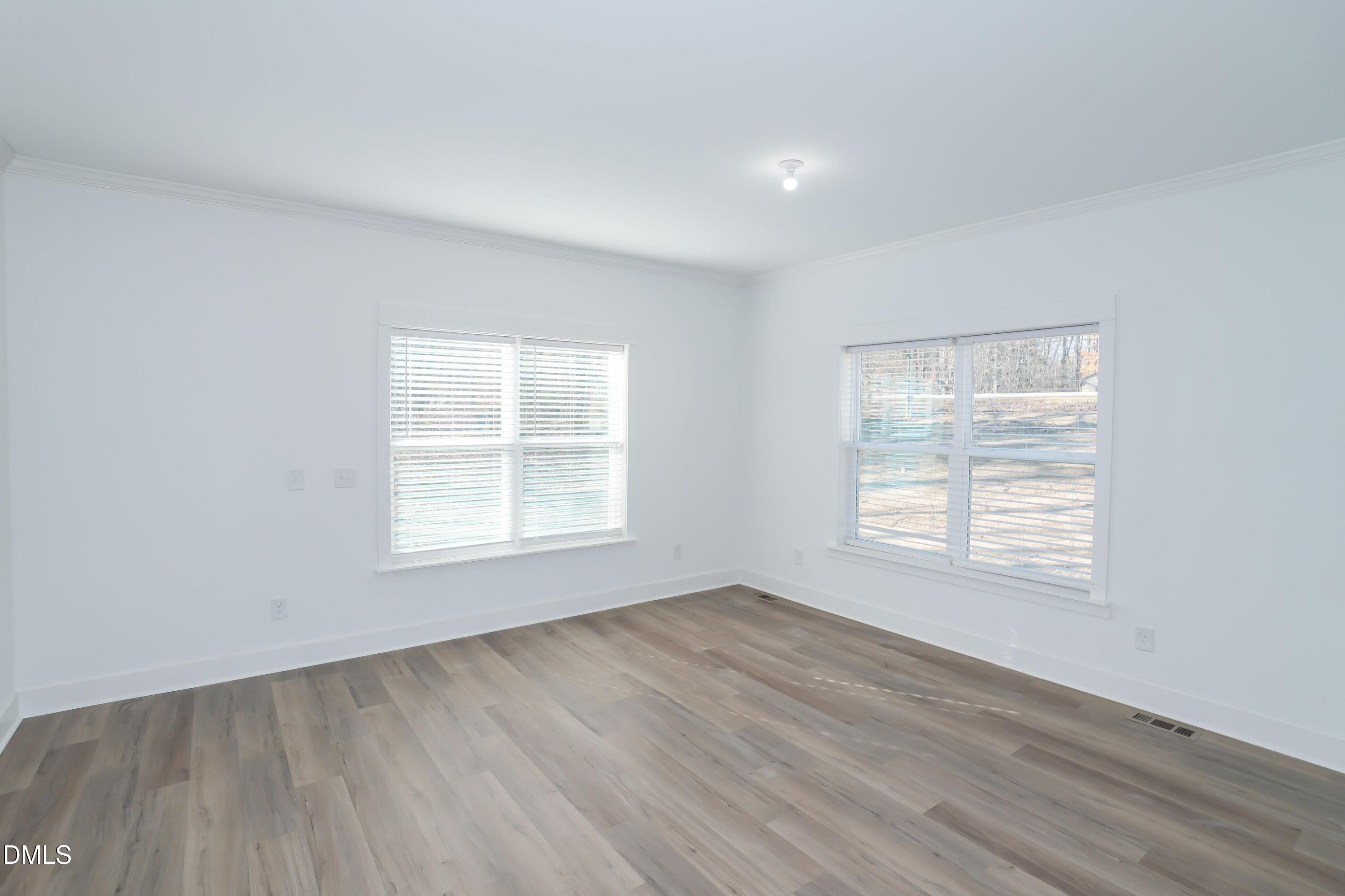 5430 Bass Mountain Road Snow Camp, NC 27349 - Photo 12 of 14 a view of an empty room with wooden floor and a window
