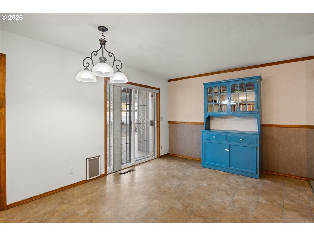 369 Upper Camp Loop Road Roseburg, OR 97470 - Photo 12 of 38 a view of livingroom with chandelier