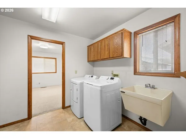 a utility room with dryer and washer