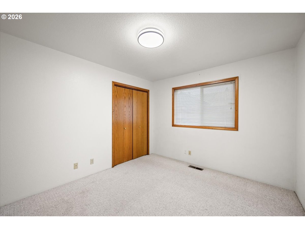369 Upper Camp Loop Road Roseburg, OR 97470 - Photo 14 of 38 a view of an empty room with a window