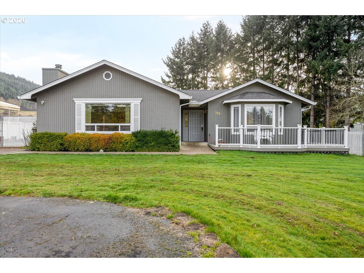 369 Upper Camp Loop Road Roseburg, OR 97470 - Photo 2 of 38 a front view of house with yard and green space