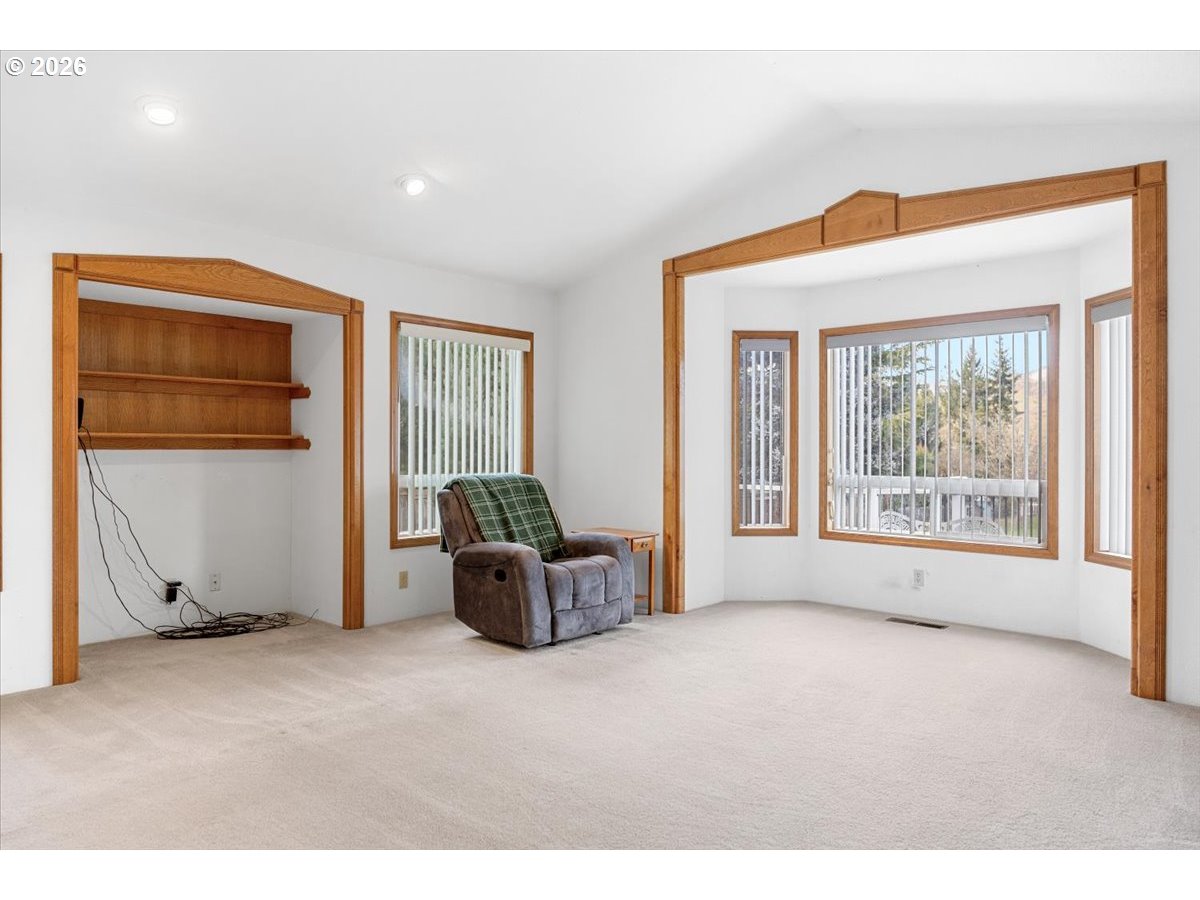 369 Upper Camp Loop Road Roseburg, OR 97470 - Photo 4 of 38 a view of an empty room with a window
