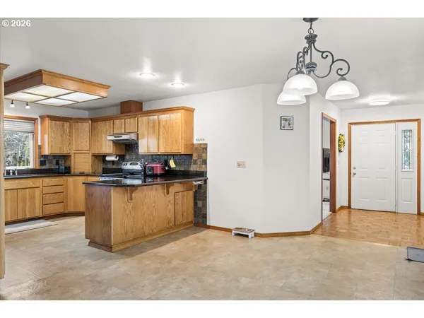 a kitchen with a refrigerator and a sink