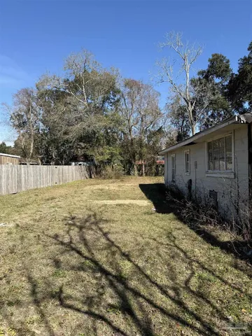 a backyard of a house with lots of green space