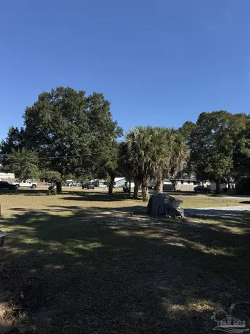 a view of swimming pool with a yard