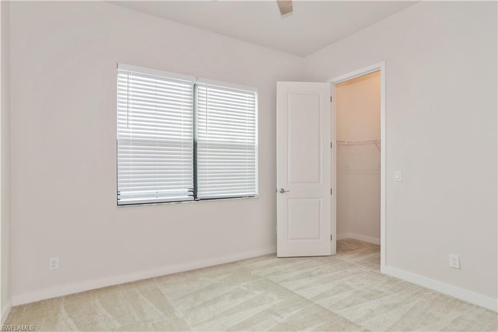 14867 Loggerhead Drive Naples, FL 34120 - Photo 14 of 21 a view of an empty room with a window