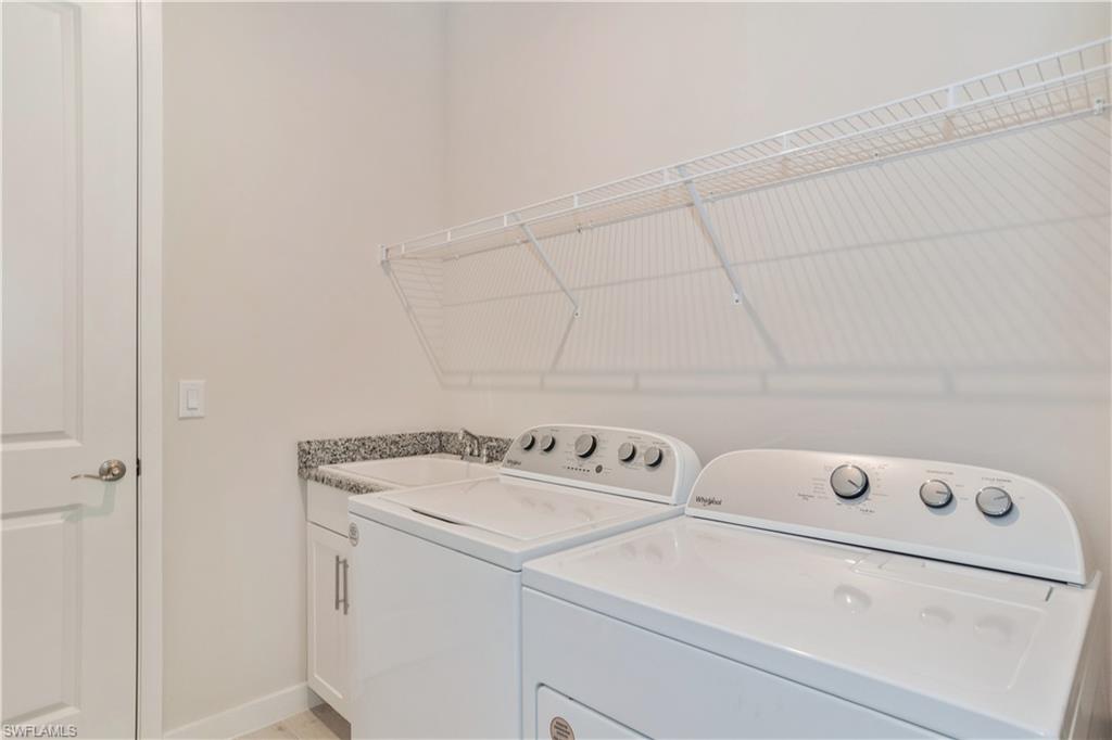 14867 Loggerhead Drive Naples, FL 34120 - Photo 19 of 21 a utility room with dryer and washer