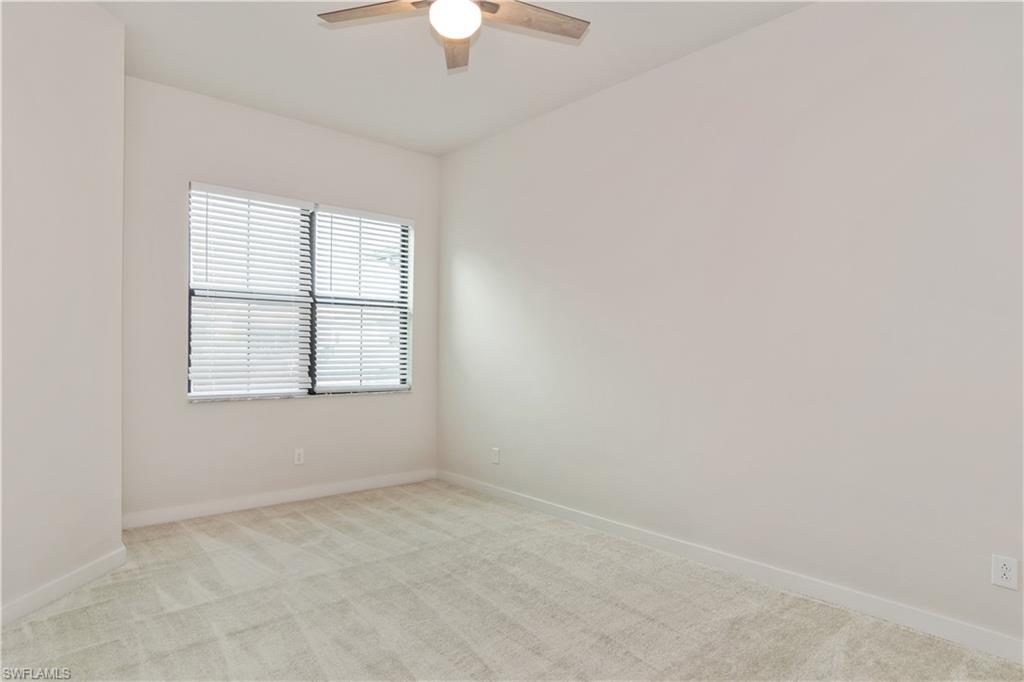 14867 Loggerhead Drive Naples, FL 34120 - Photo 9 of 21 an empty room with a window