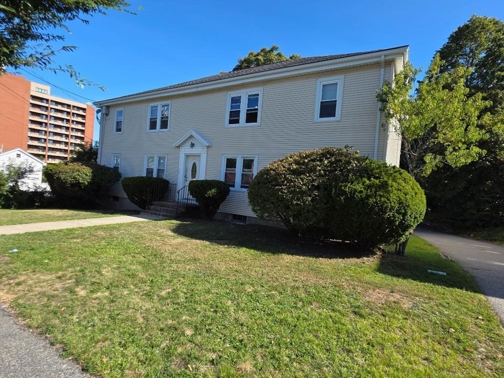 110 Clay Street, Unit 3 Quincy, MA 02170 - Photo 2 of 10 a view of a house with backyard and garden