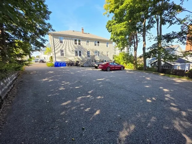 a view of a house with a yard and garage