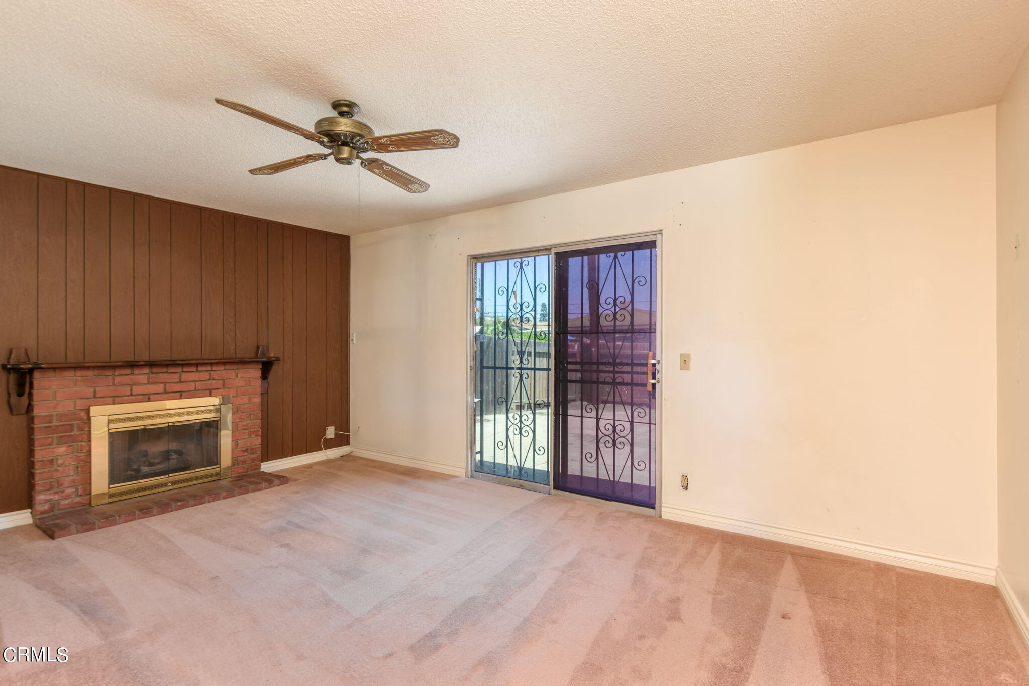 4410 Reeder Avenue Oxnard, CA 93033 - Photo 3 of 20 a view of an empty room with a fireplace and a window