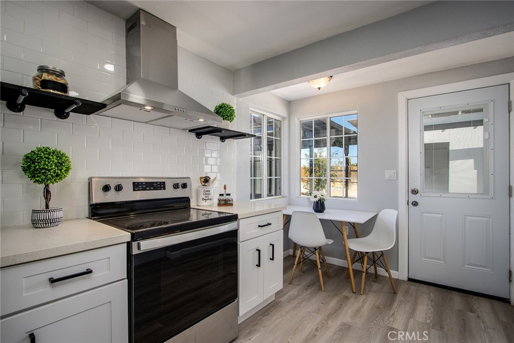 62932 Shifting Sands Joshua Tree, CA 92252 - Photo 11 of 45 a kitchen with a sink stove and cabinets