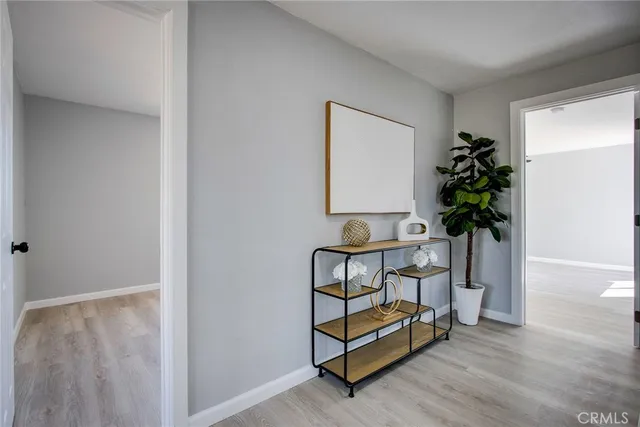 a view of room with ceiling fan and window