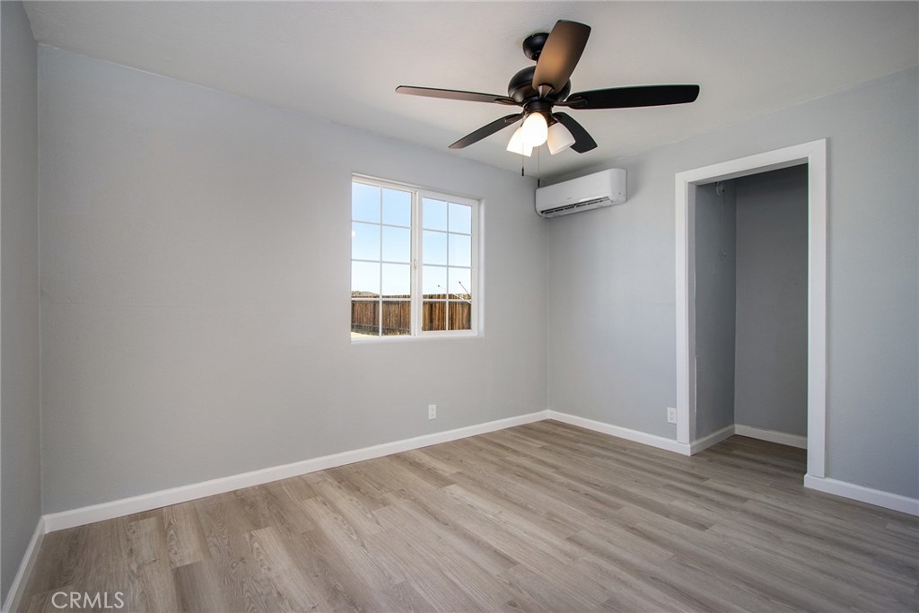 62932 Shifting Sands Joshua Tree, CA 92252 - Photo 14 of 45 a view of room with ceiling fan and window