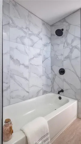 a view of a ceiling fan and wooden floor