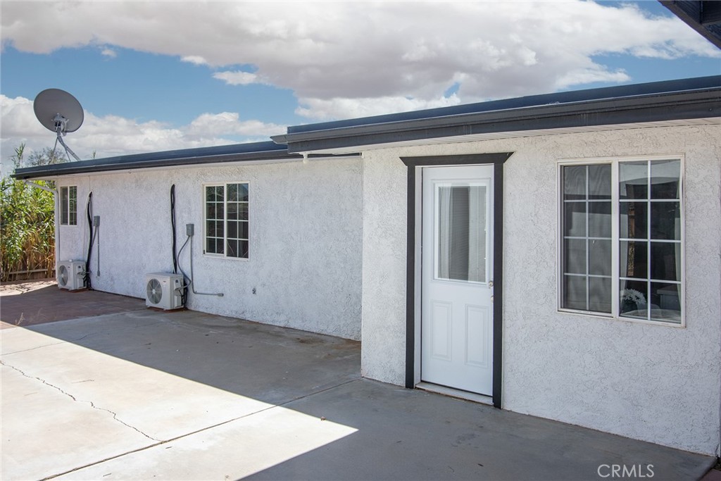 62932 Shifting Sands Joshua Tree, CA 92252 - Photo 26 of 45 a view of empty room with windows