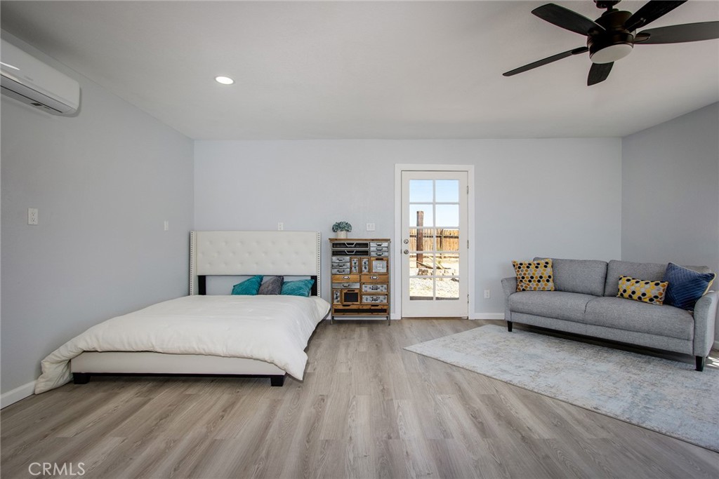 62932 Shifting Sands Joshua Tree, CA 92252 - Photo 30 of 45 a bedroom with a bed and a couch