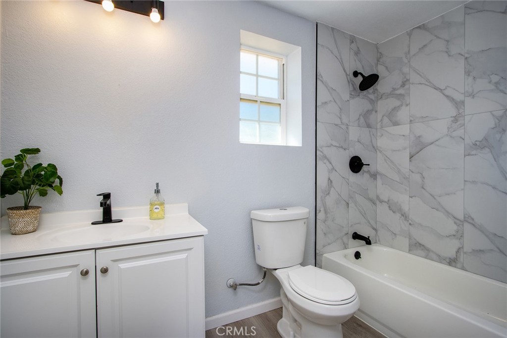 62932 Shifting Sands Joshua Tree, CA 92252 - Photo 33 of 45 a bathroom with a sink a toilet and shower