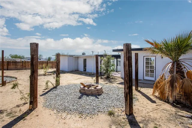 a view of a hallway with wooden fence