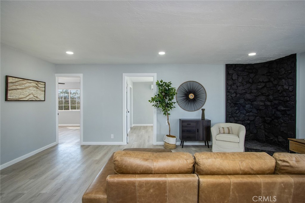 62932 Shifting Sands Joshua Tree, CA 92252 - Photo 7 of 45 a living room with furniture and a fireplace