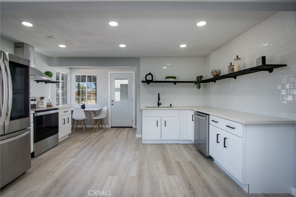 62932 Shifting Sands Joshua Tree, CA 92252 - Photo 9 of 45 a kitchen with a sink appliances and cabinets