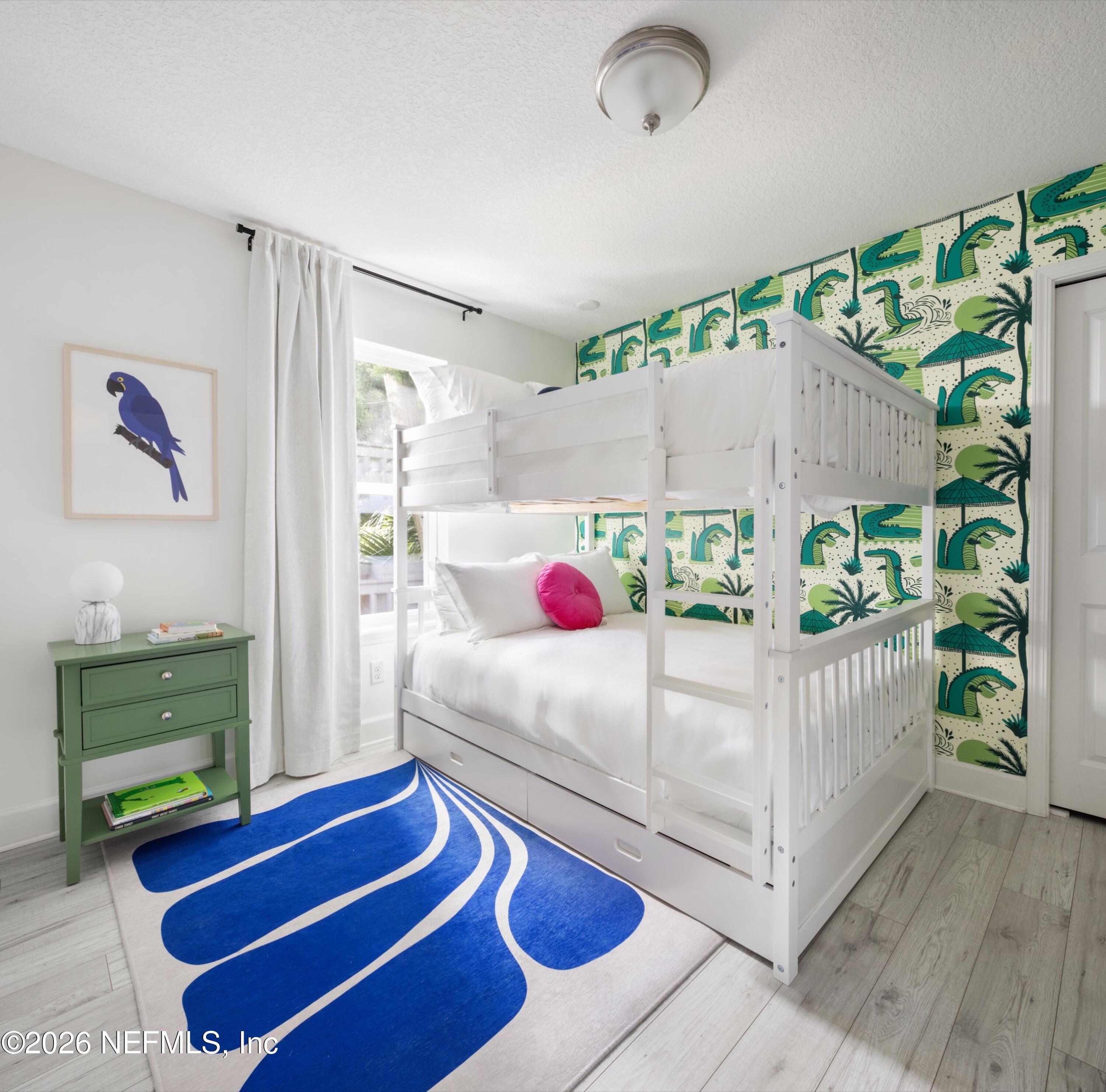 406 3rd St Street St. Augustine, FL 32084 - Photo 16 of 56 a bedroom with furniture and a wooden floor