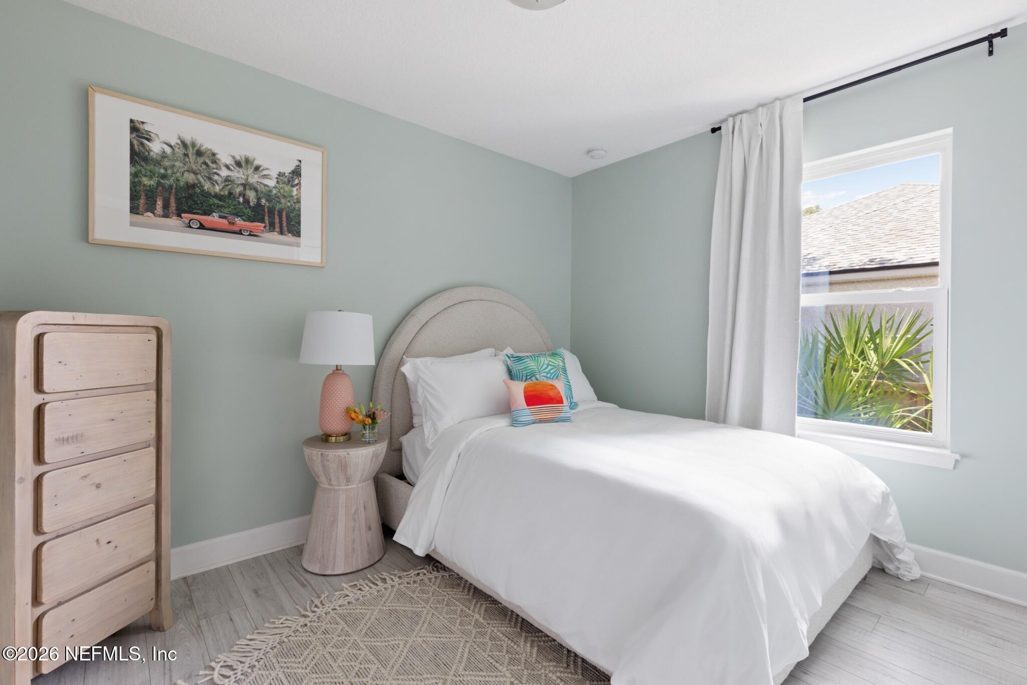 406 3rd St Street St. Augustine, FL 32084 - Photo 18 of 56 a bedroom with a bed and a dresser