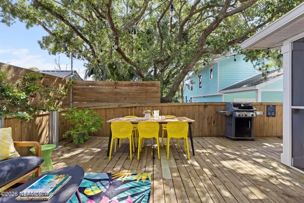 a view of roof deck with furniture