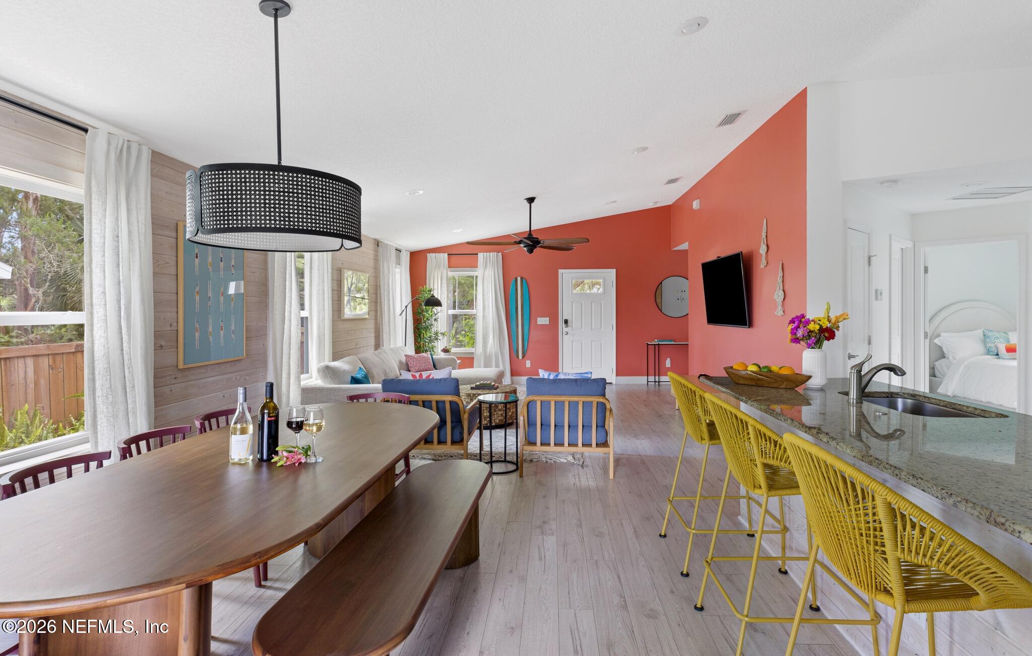 406 3rd St Street St. Augustine, FL 32084 - Photo 33 of 56 a dining room filled chandelier and wooden floor