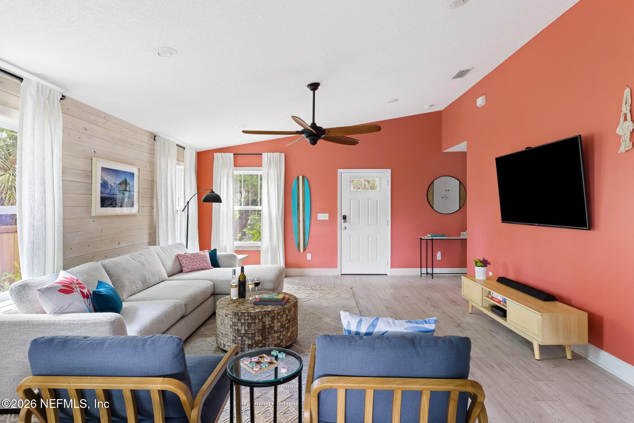 406 3rd St Street St. Augustine, FL 32084 - Photo 35 of 56 a living room with furniture and a flat screen tv
