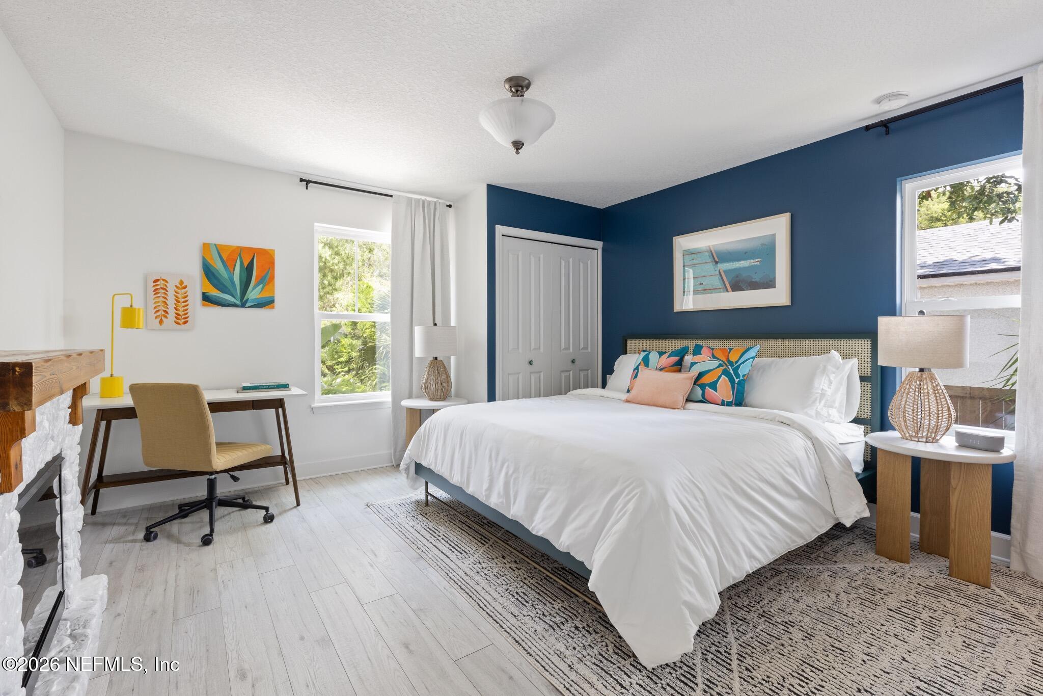 406 3rd St Street St. Augustine, FL 32084 - Photo 6 of 56 a bedroom with a bed and wooden floor