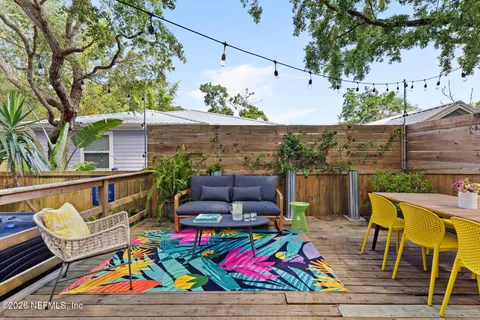 an outdoor space with seating area and furniture