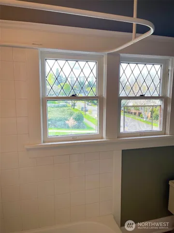 a view of an empty room with a window