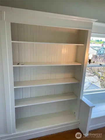 a view of a chairs and table on the wooden floor