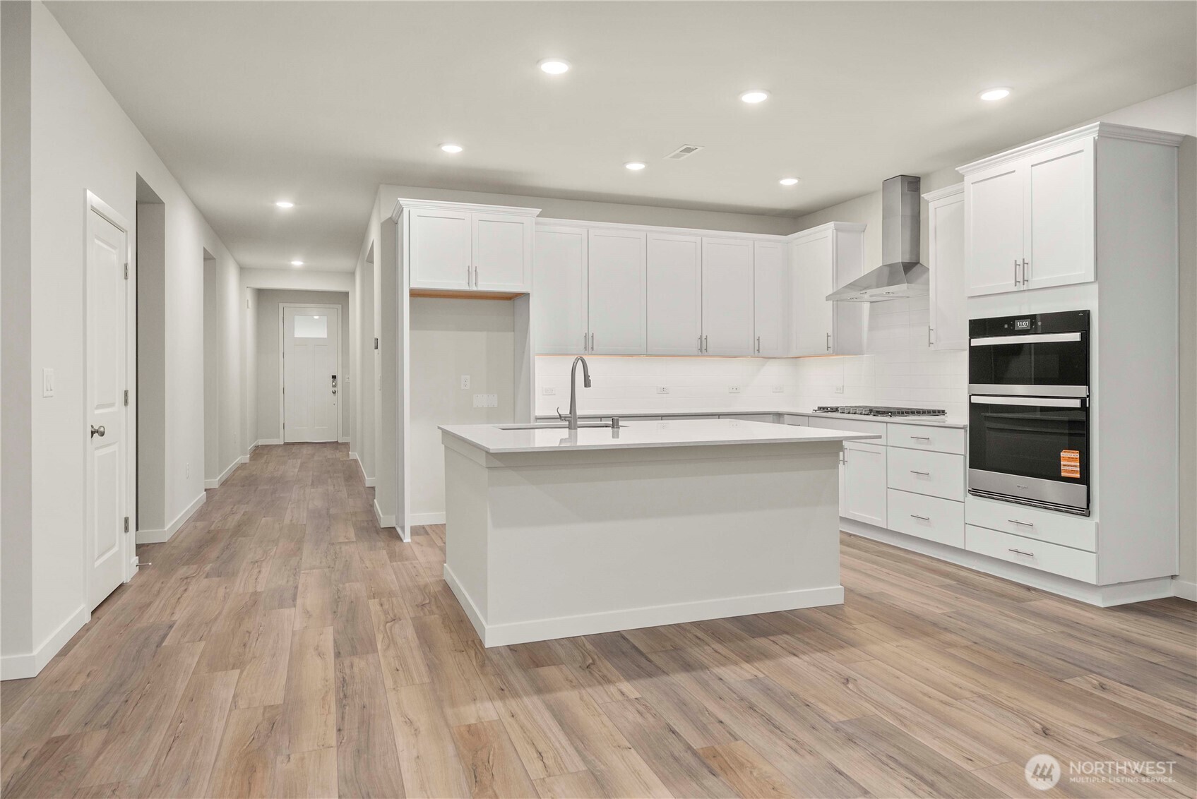 4083 Southwest Rustler Street Port Orchard, WA 98367 - Photo 11 of 32 a view of kitchen with wooden floor and electronic appliances