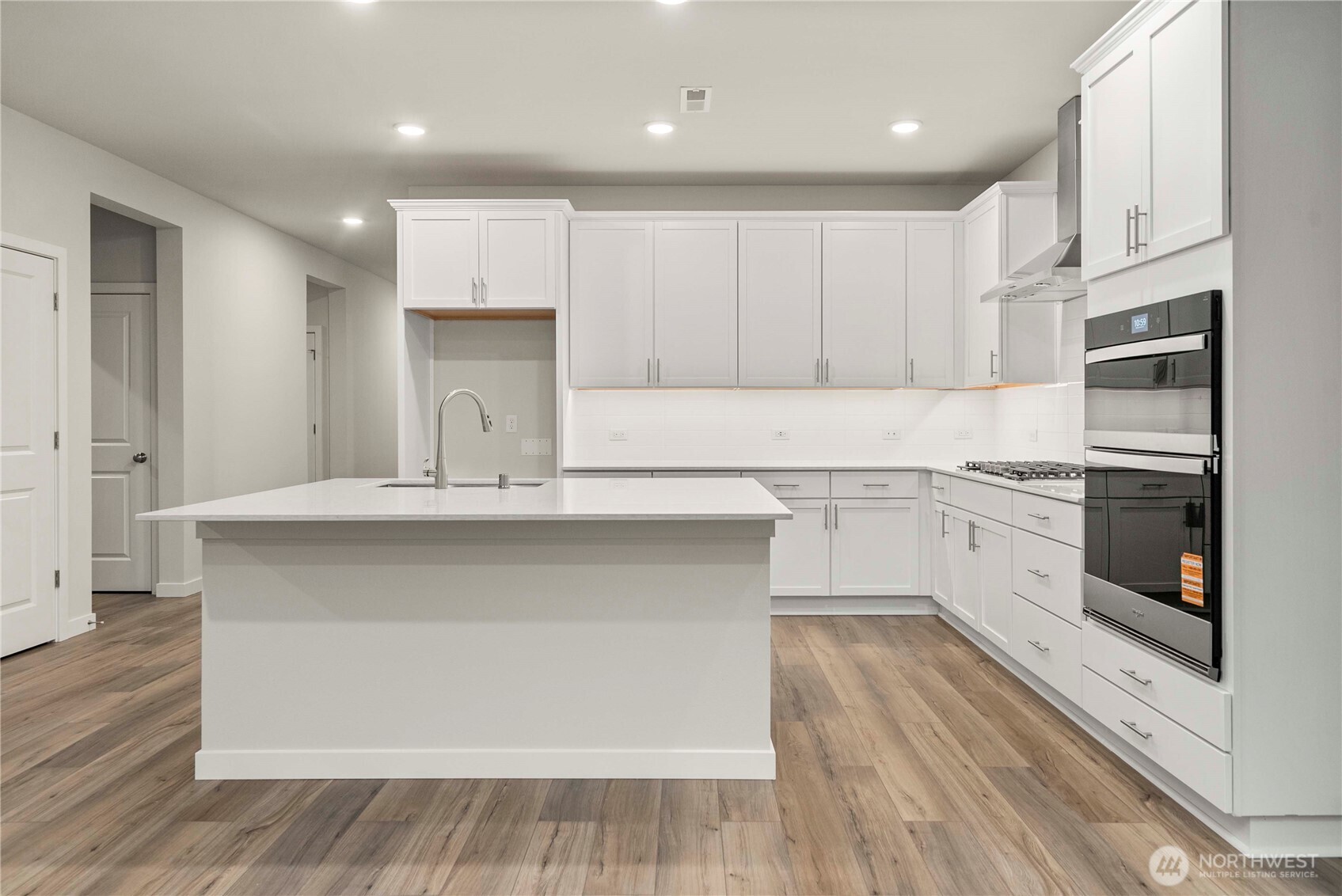4083 Southwest Rustler Street Port Orchard, WA 98367 - Photo 12 of 32 a kitchen with a sink stainless steel appliances and cabinets